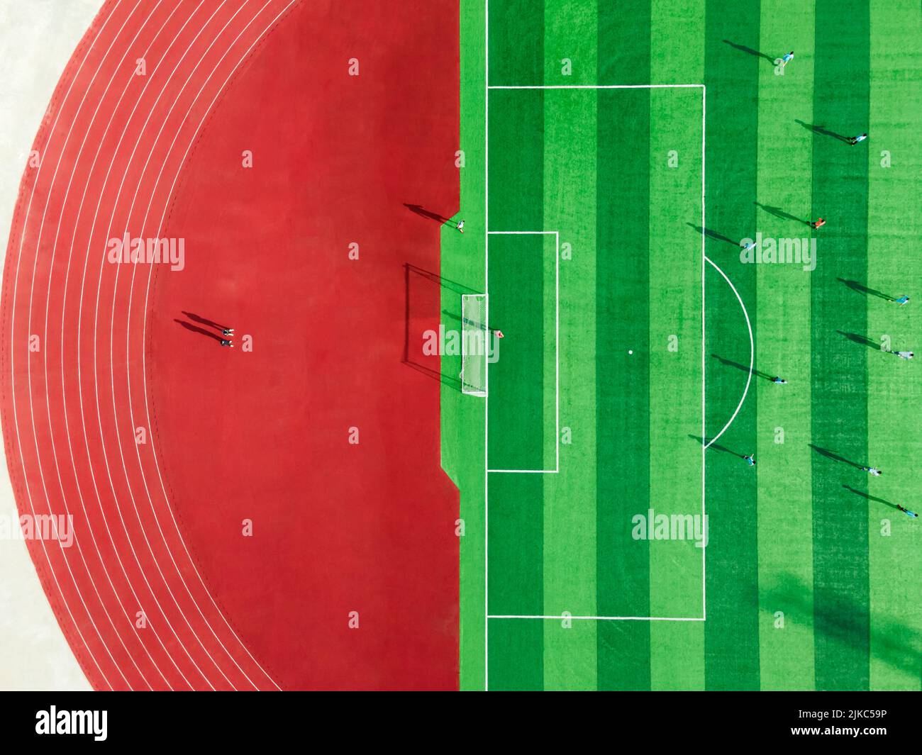 An aerial view of sport stadium of football with football players in ...