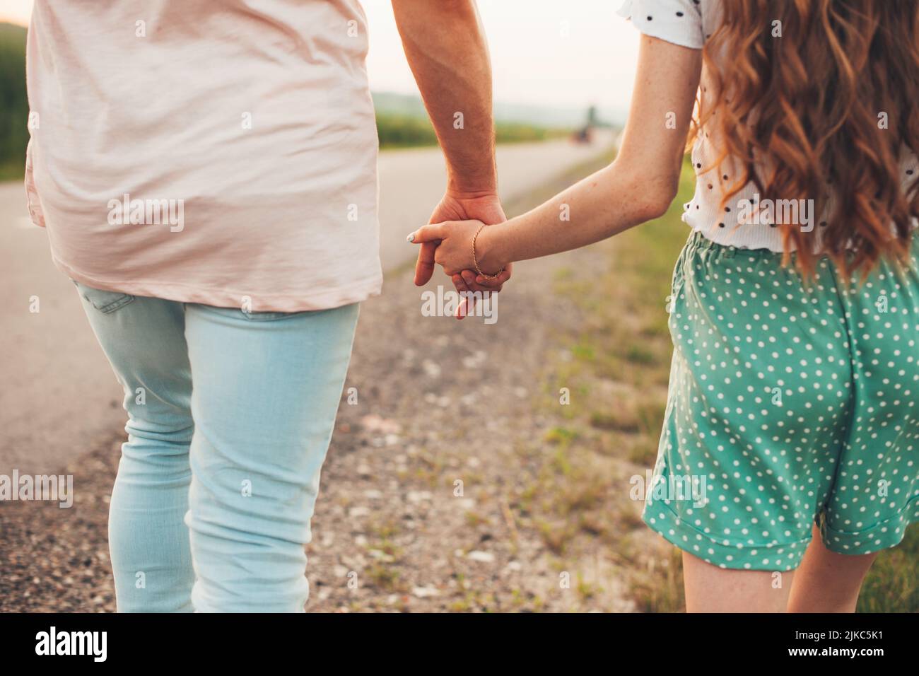 Back view couple walking arms hi-res stock photography and images - Alamy
