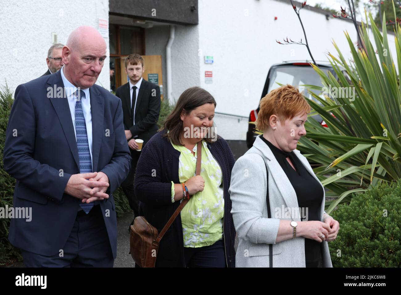 (left to right) Mark Durkan, Mo Hume and Pat Durkan leaving the funeral