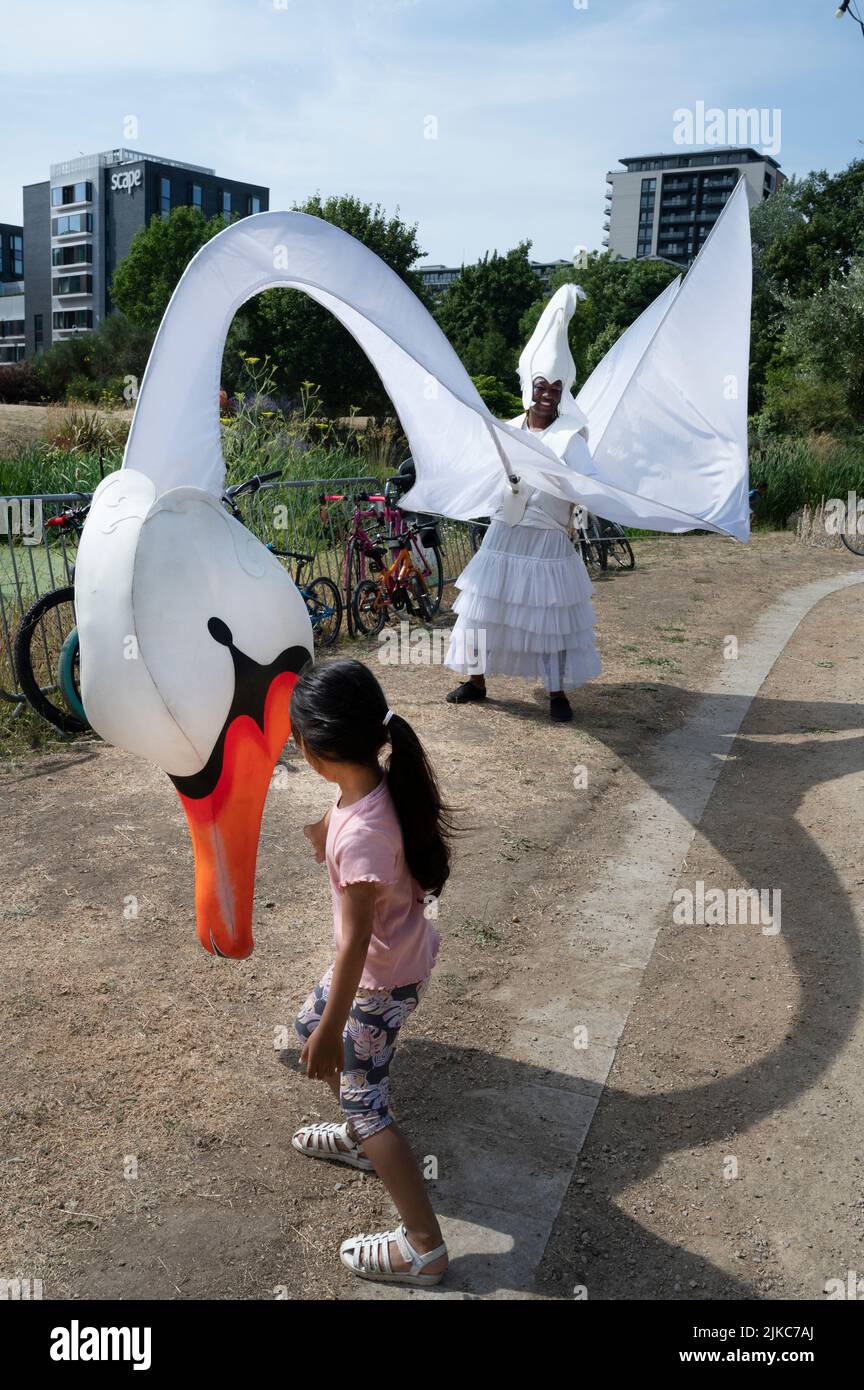 Mile End Arts Pavilion, Tower Hamlets, London. Anouska in swan costume, introducing young people to carnival cotumes, to celebrate the 200 year annive Stock Photo
