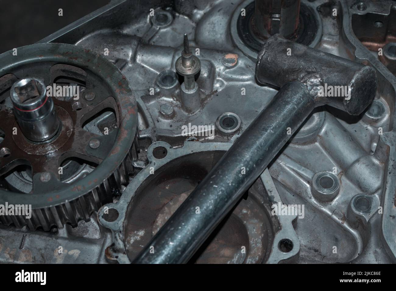 a close up of auto mechanic's hands repairing car troubleshooting with