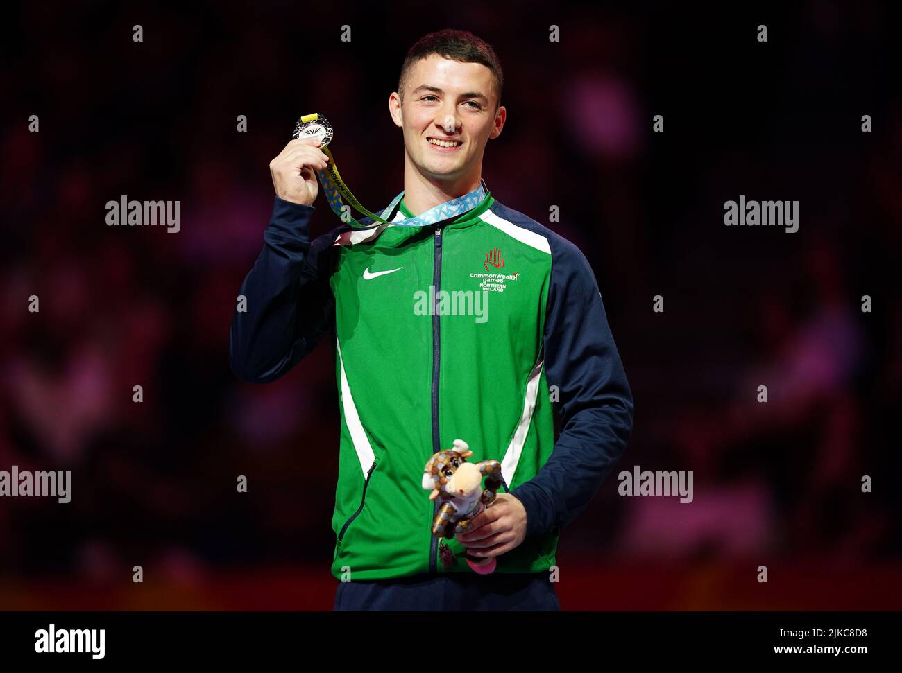 Northern Ireland's Rhys McClenaghan receives his silver medal during