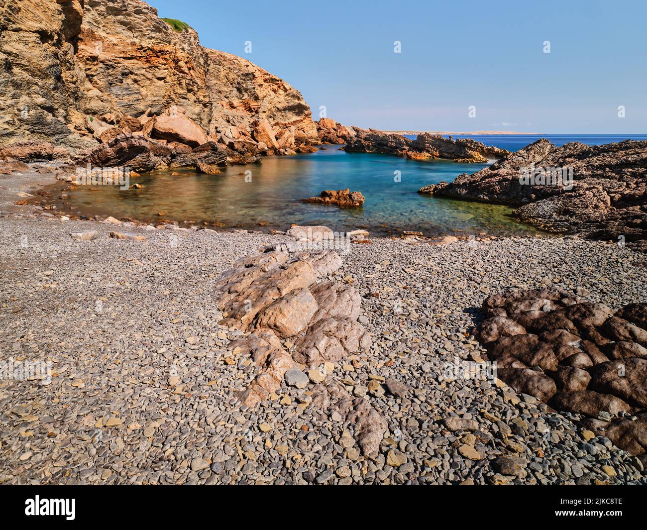 Rocks and sea in long exposure in Menorca, Spain Stock Photo - Alamy