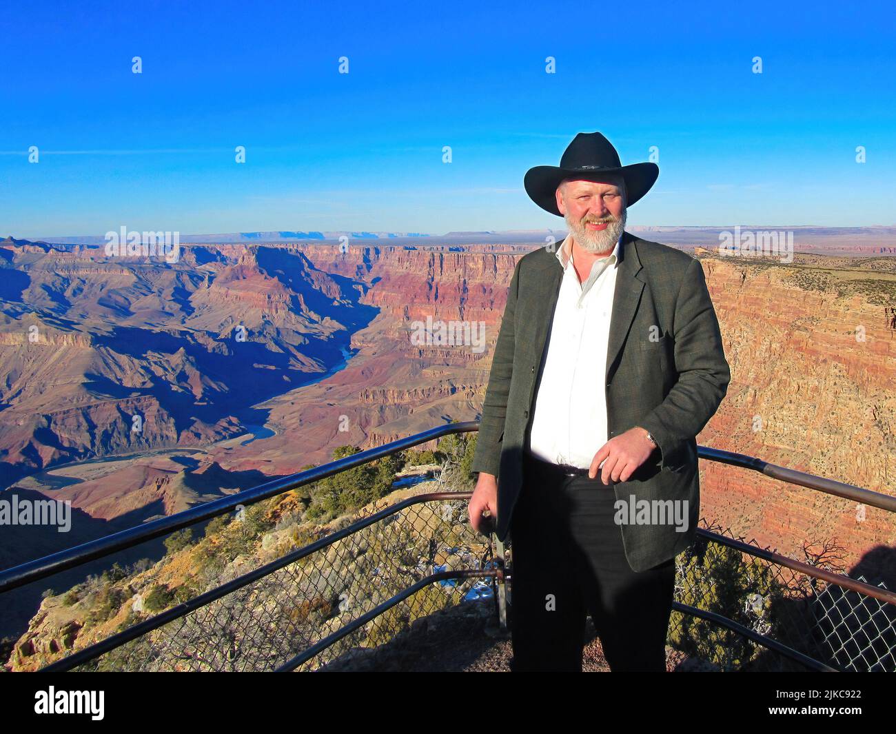 man in front of the Grand Canyon in Arizona Stock Photo