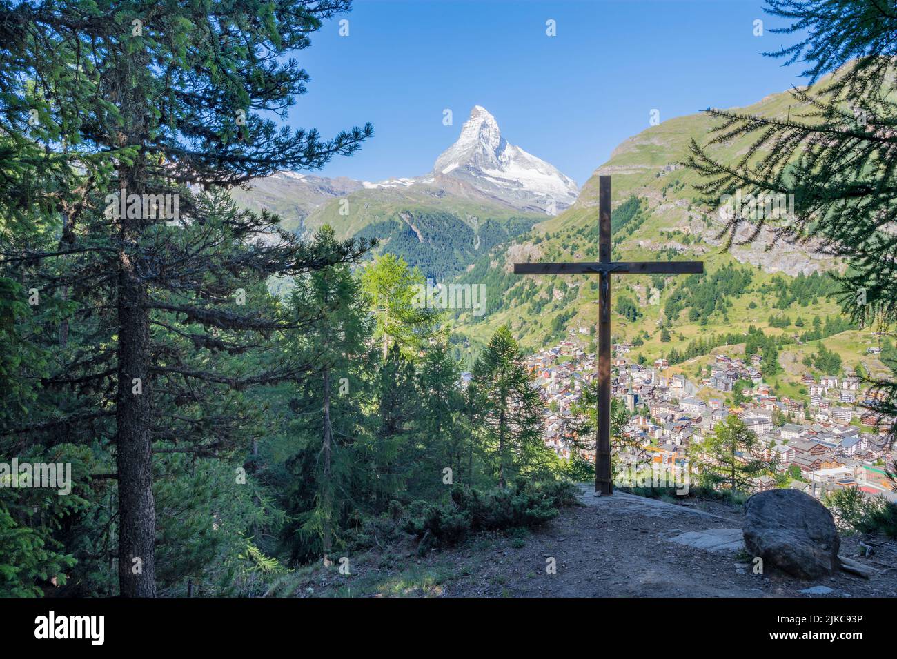 The Matterhorn peak with the cross over the Zermatt. Stock Photo