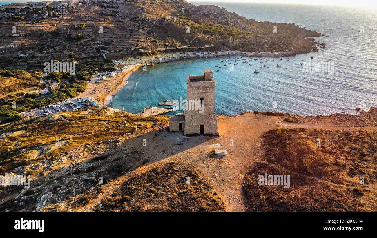 An aerial shot of Lippija tower on a shore of sea at sunset Stock Photo ...