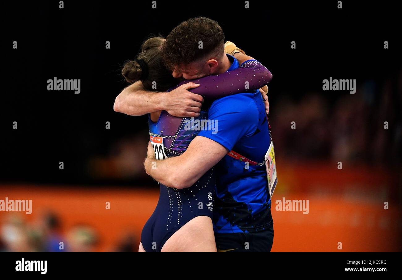 Scotland's Shannon Archer celebrates with a coach after taking bronze