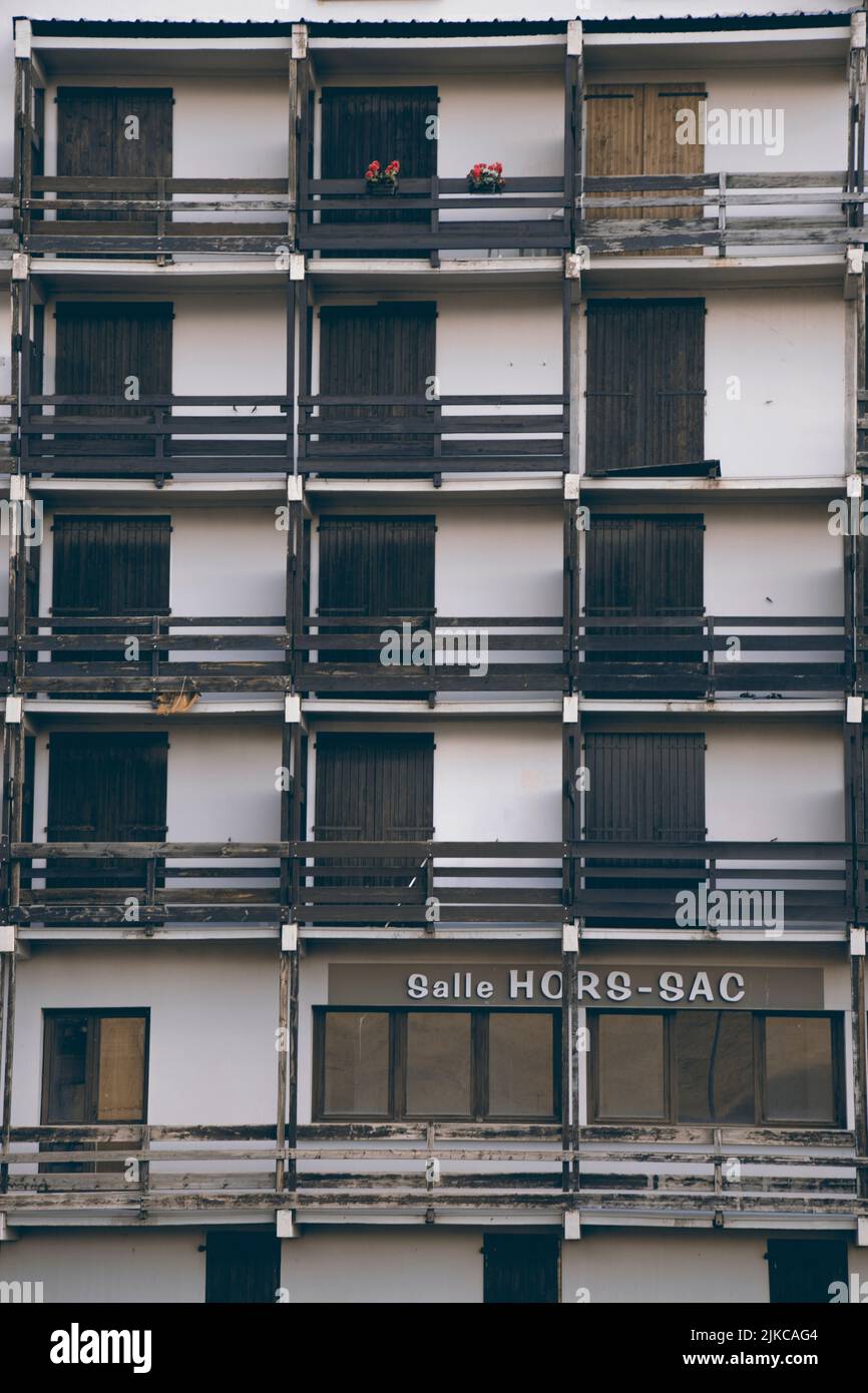 A vertical closeup of a hotel building with balconies Stock Photo - Alamy