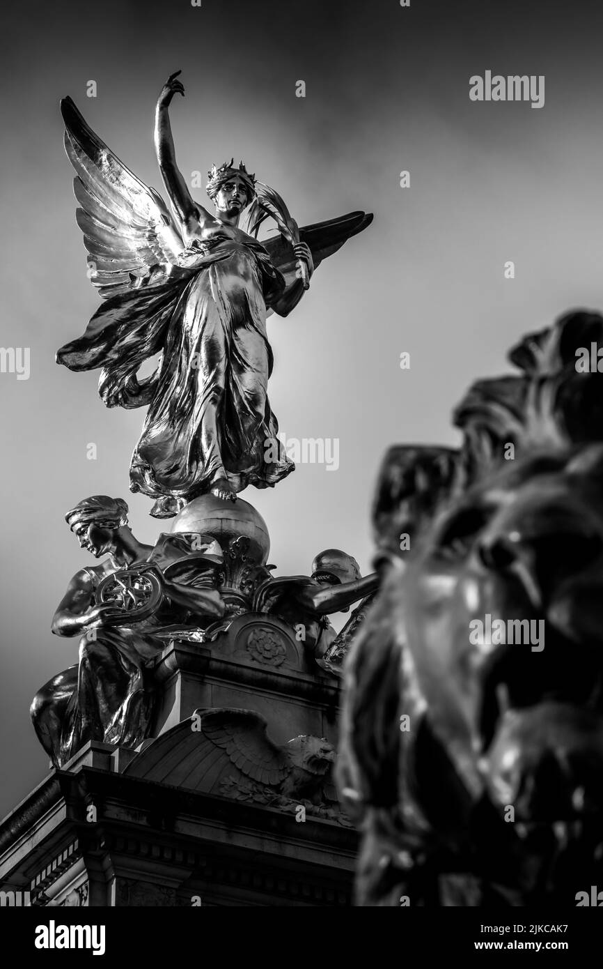 A low angle of the Queen Victoria Memorial statue in London, England in
