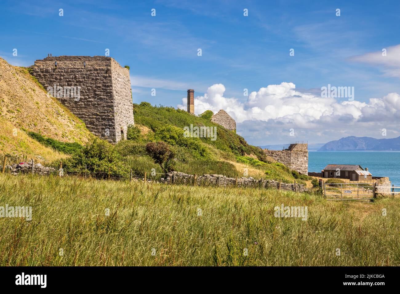 The disused Penmon Quarry buildings on the Menai Strait, Isle of Anglesey, North Wales Stock Photo