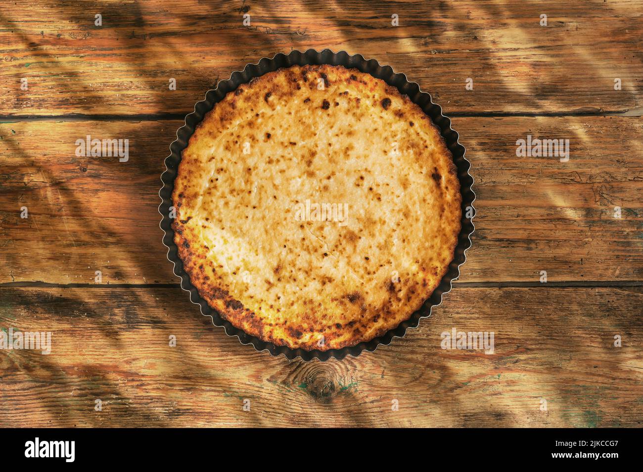 Cottage cheese casserole. Homemade cheese pie on a rustic wooden background. Home food concept. High quality photo Stock Photo