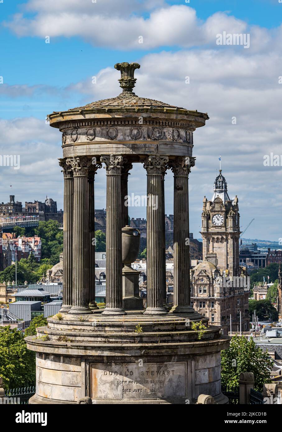 View of Dugald Stewart Monument over city skyline with Balmoral hotel clock tower, Edinburgh, Scotland, UK Stock Photo