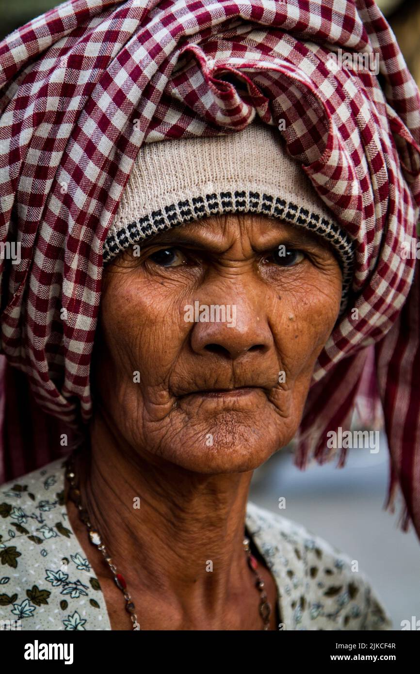 A vertical portrait of an elderly Cambodian woman Stock Photo