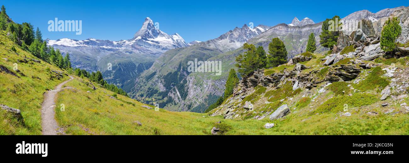 The panorama of swiss walliser alps with the Matterhorn peak over the mattertal valley. Stock Photo