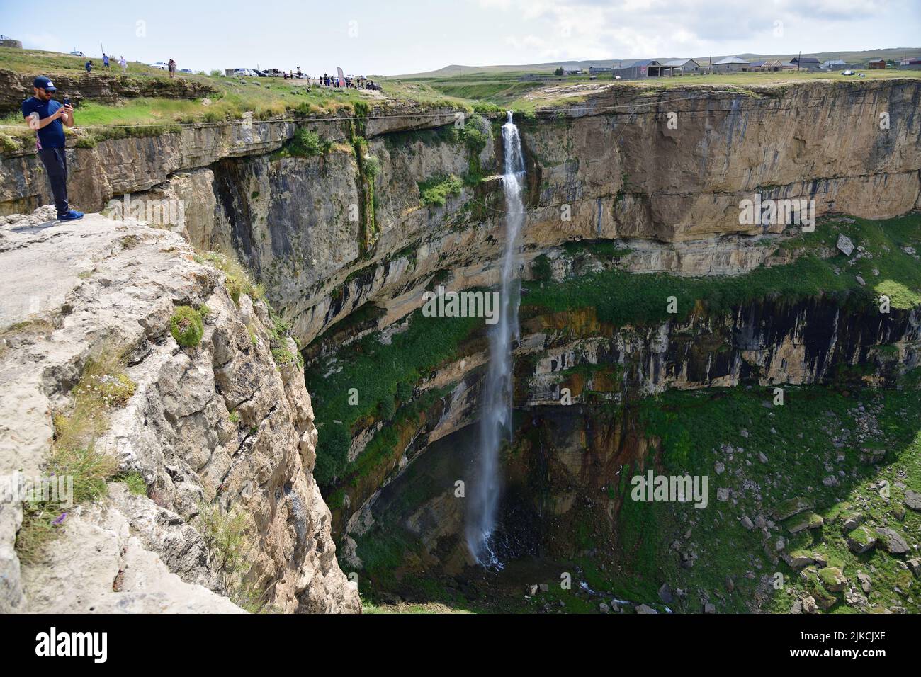 Dagestan, Russia - 21 July, 2022:  Tourists visit the Itlyatlyar Waterfall. Hunzah. Canyon Of Khunzakh. Sights Of The Caucasus mountains. Russia, Dage Stock Photo