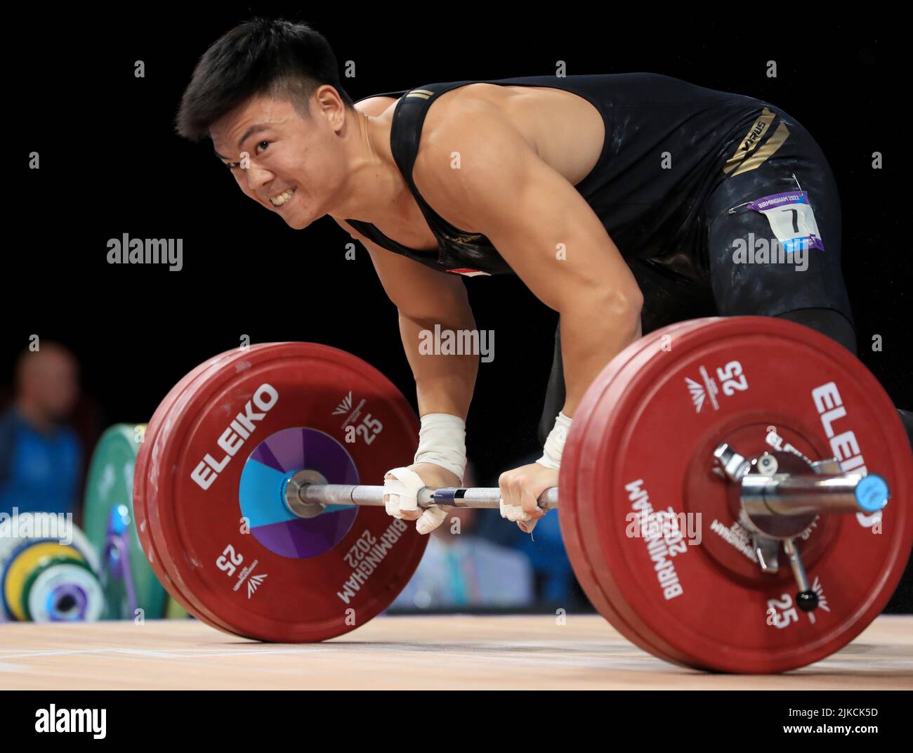 Singapore’s Kang Yin Lim reacts after failing a lift during the Men’s ...