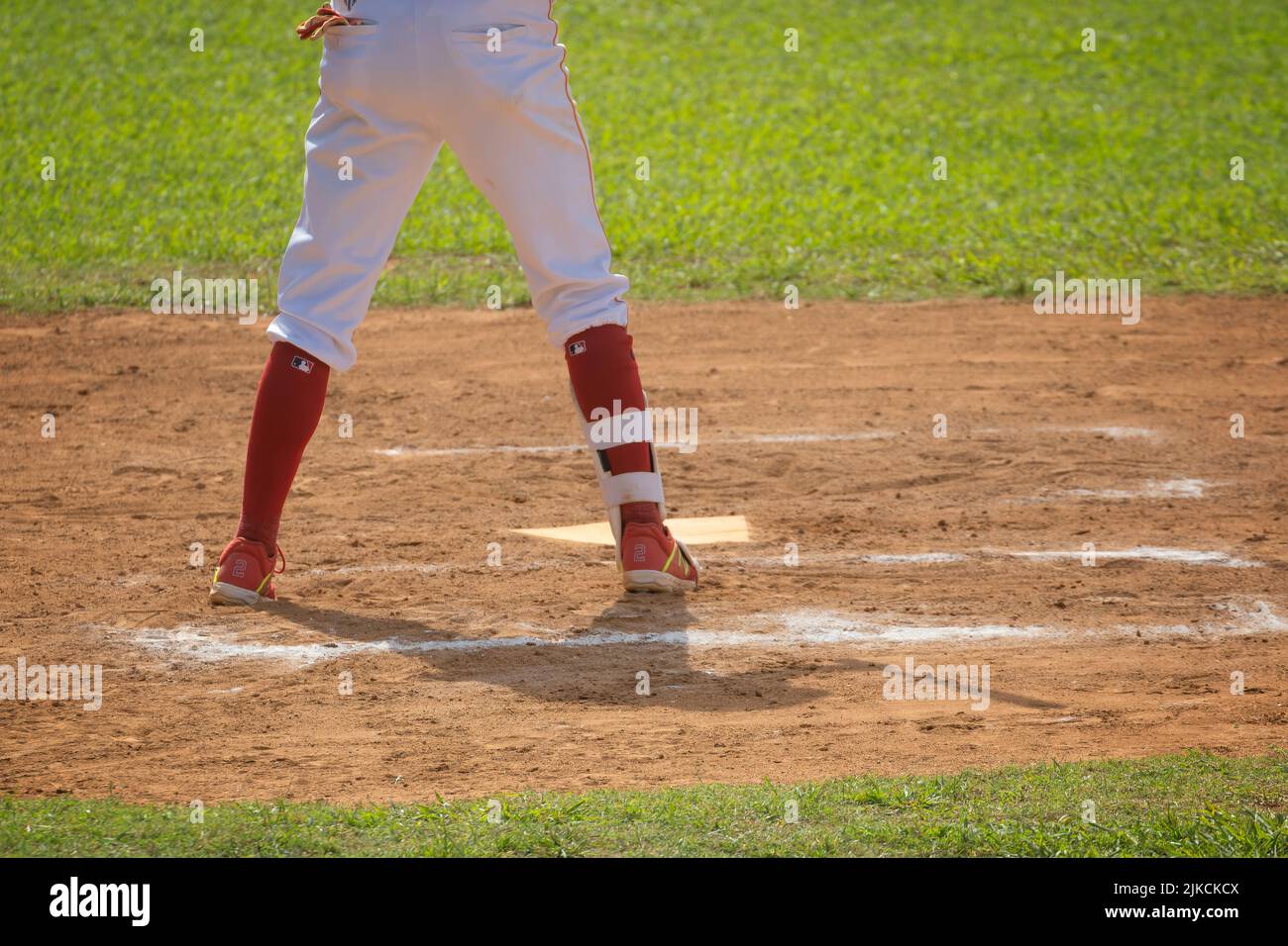 a view of a baseball player's legs Stock Photo Alamy