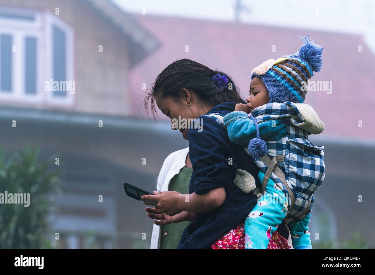 Indian woman carrying baby back hi-res stock photography and images - Alamy