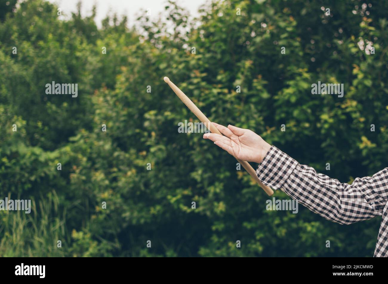 Young girl musician drummer hand twirling drumstick Stock Photo Alamy
