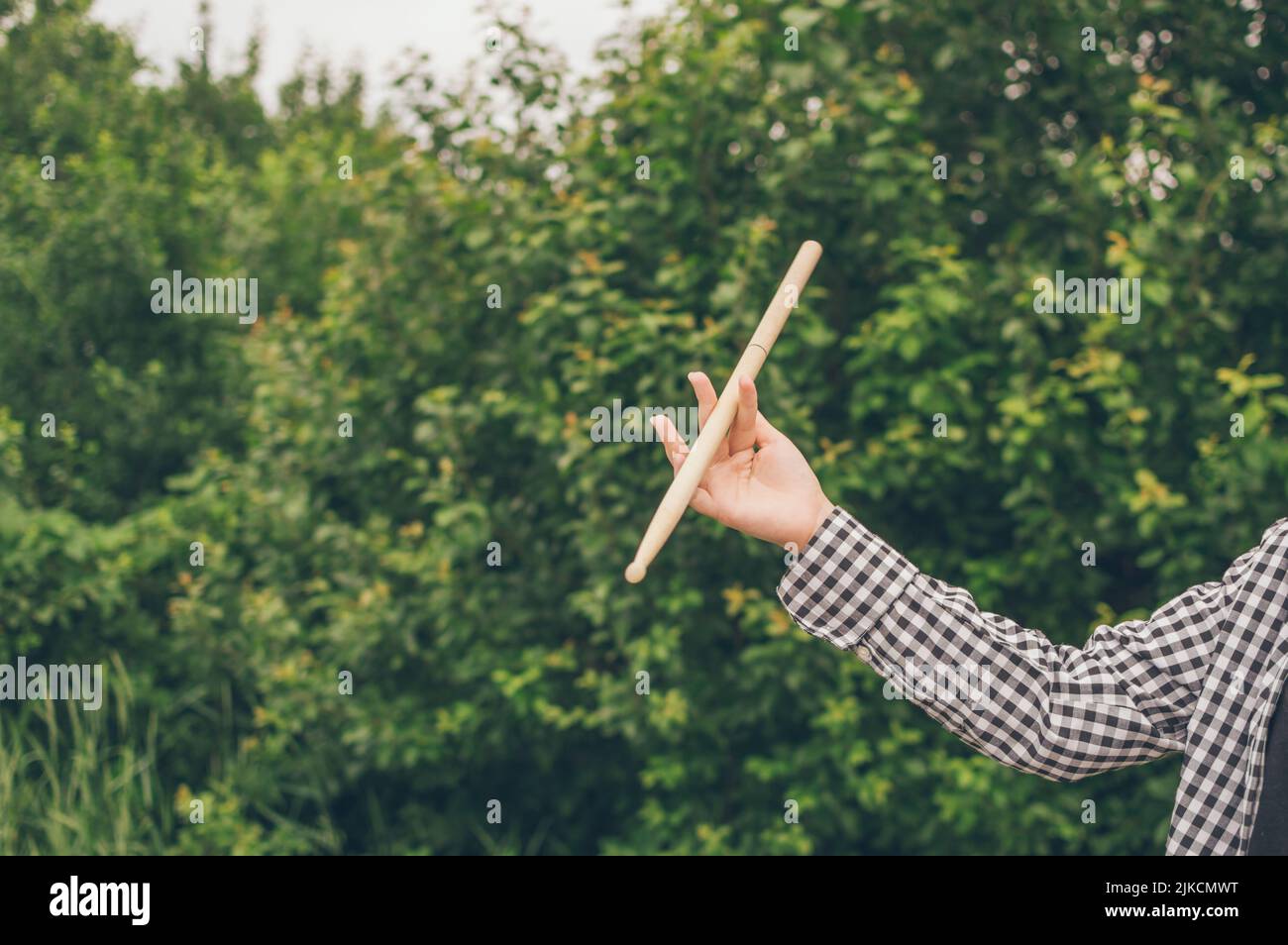 Young girl musician drummer hand twirling drum stick Stock Photo Alamy