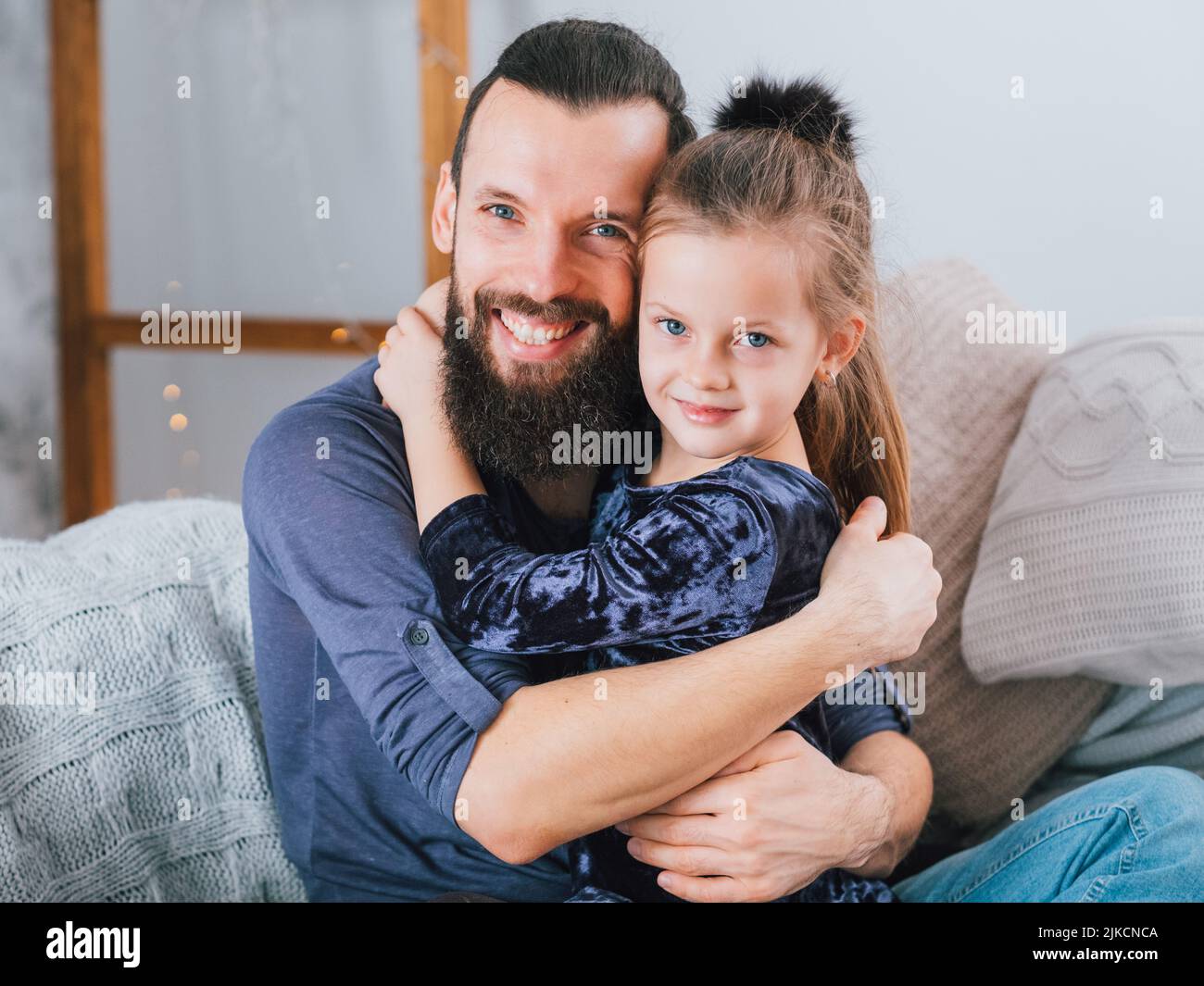 happy family relationship father hugging daughter Stock Photo