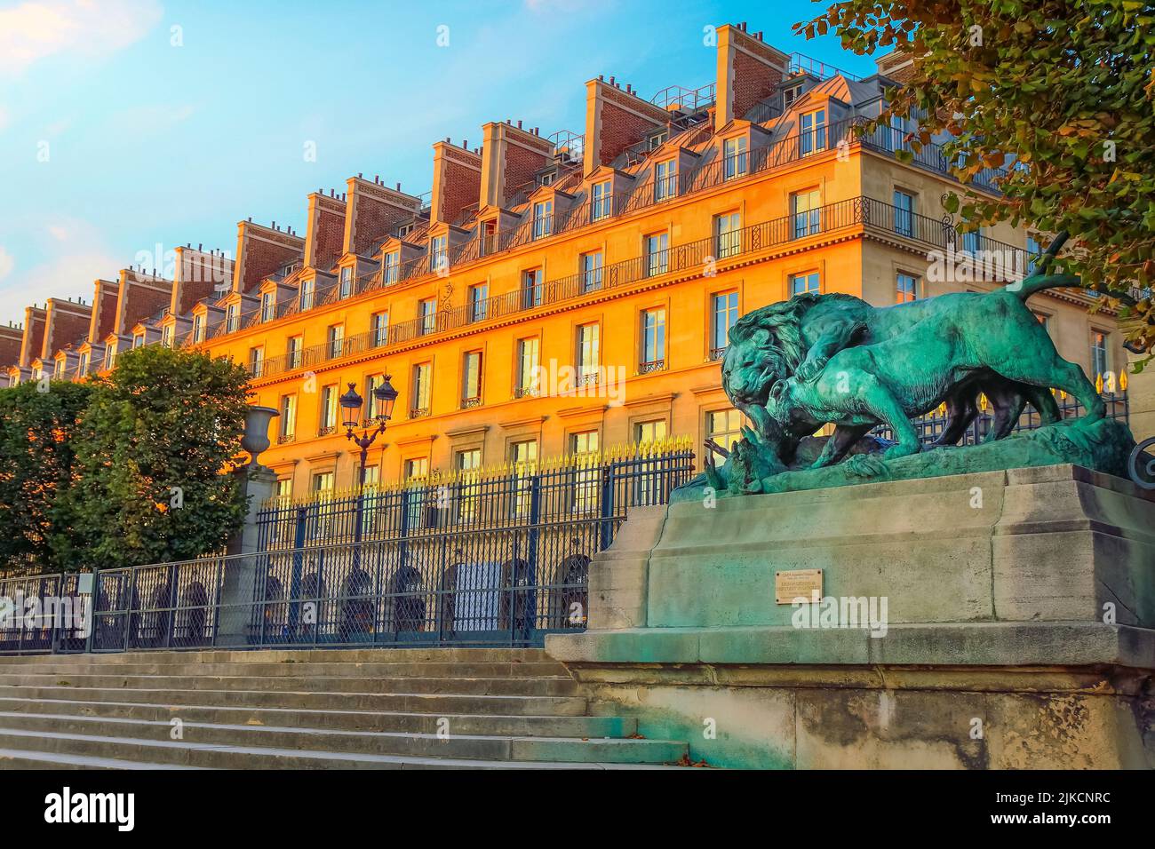 Lion statue and entrace gate to Tuileries gardens in Paris, France Stock Photo