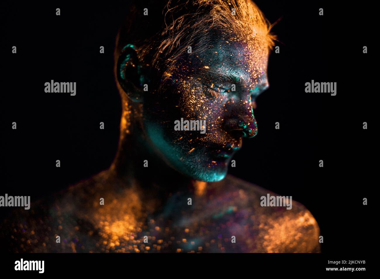 Portrait of a man painted in fluorescent UV colors Stock Photo - Alamy