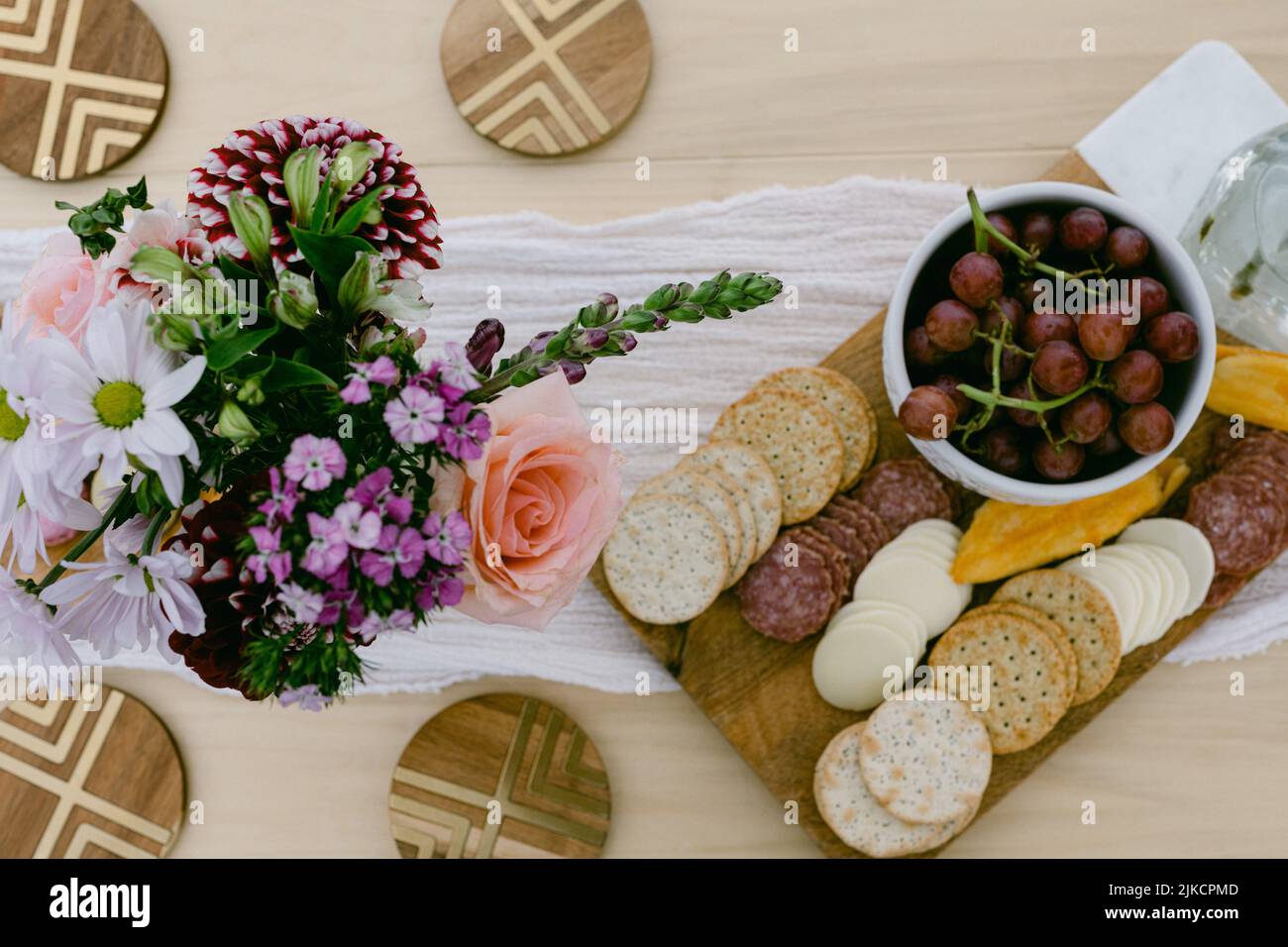 charcuterie board and grapes on wood table Stock Photo