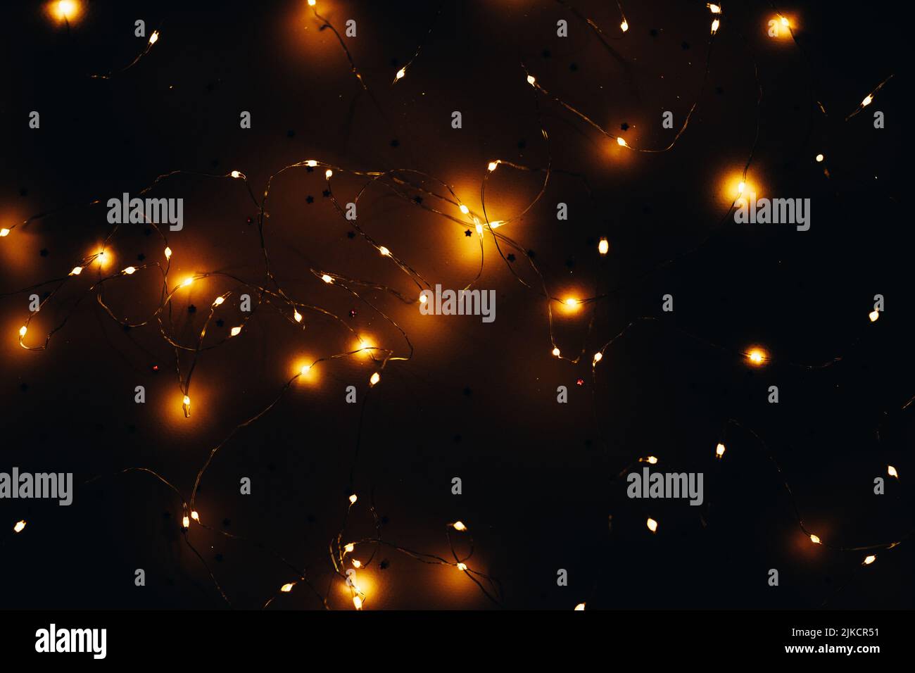 warm white led string lights black background Stock Photo Alamy