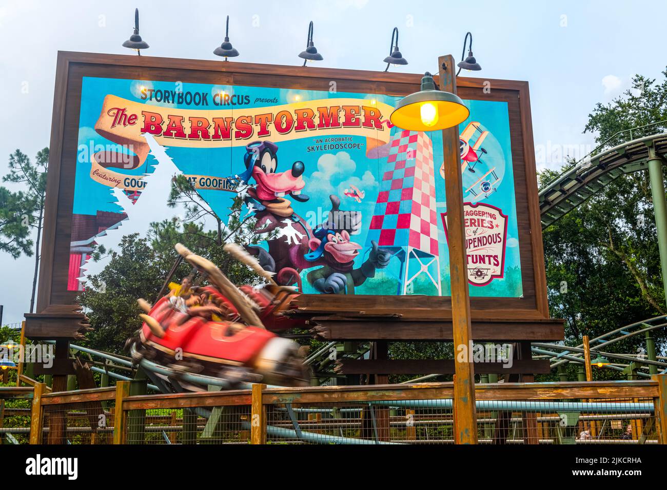 Blurred motion of a cart in the Barnstormer amusement park ride or roller coaster Stock Photo