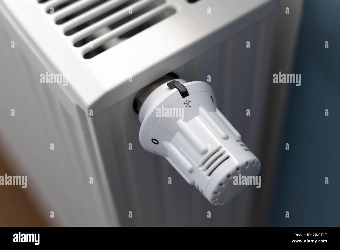 Turn down the heating thermostat to save gas Stock Photo Alamy
