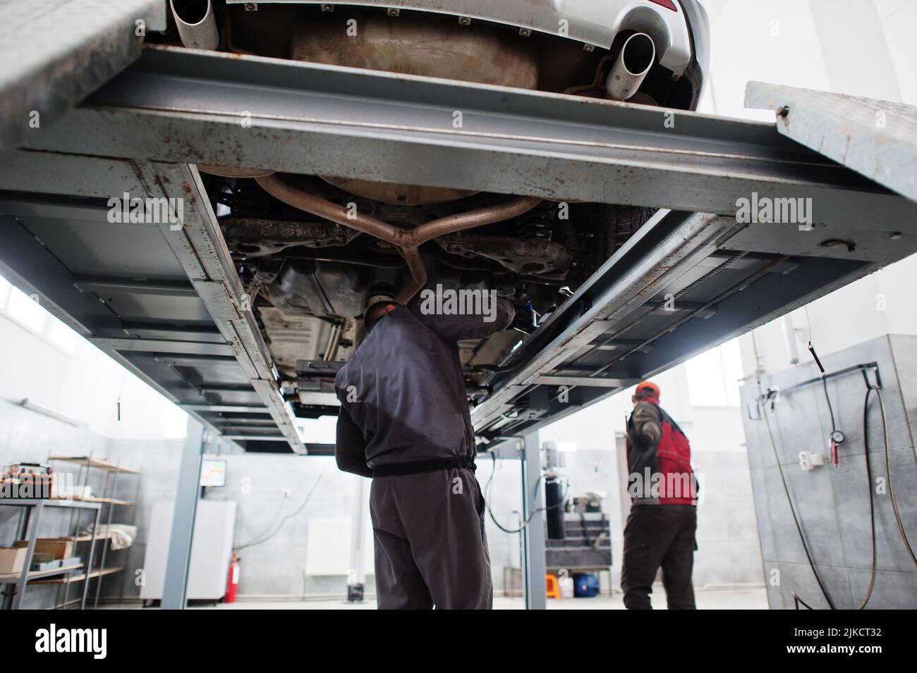 Auto mechanic sets american SUV car for diagnostics and configuration ...