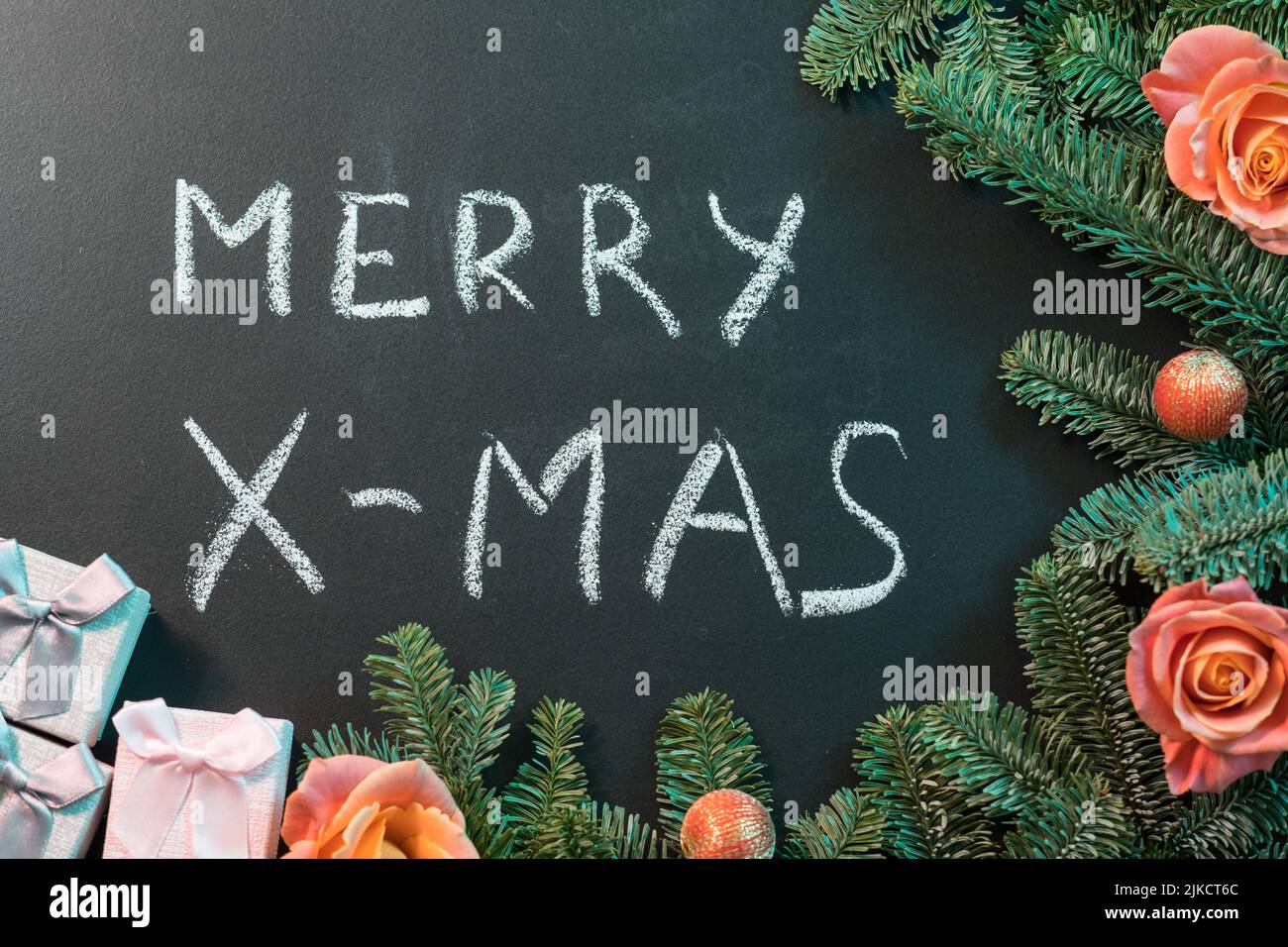 merry xmas congratulation green fir tree rose buds Stock Photo Alamy