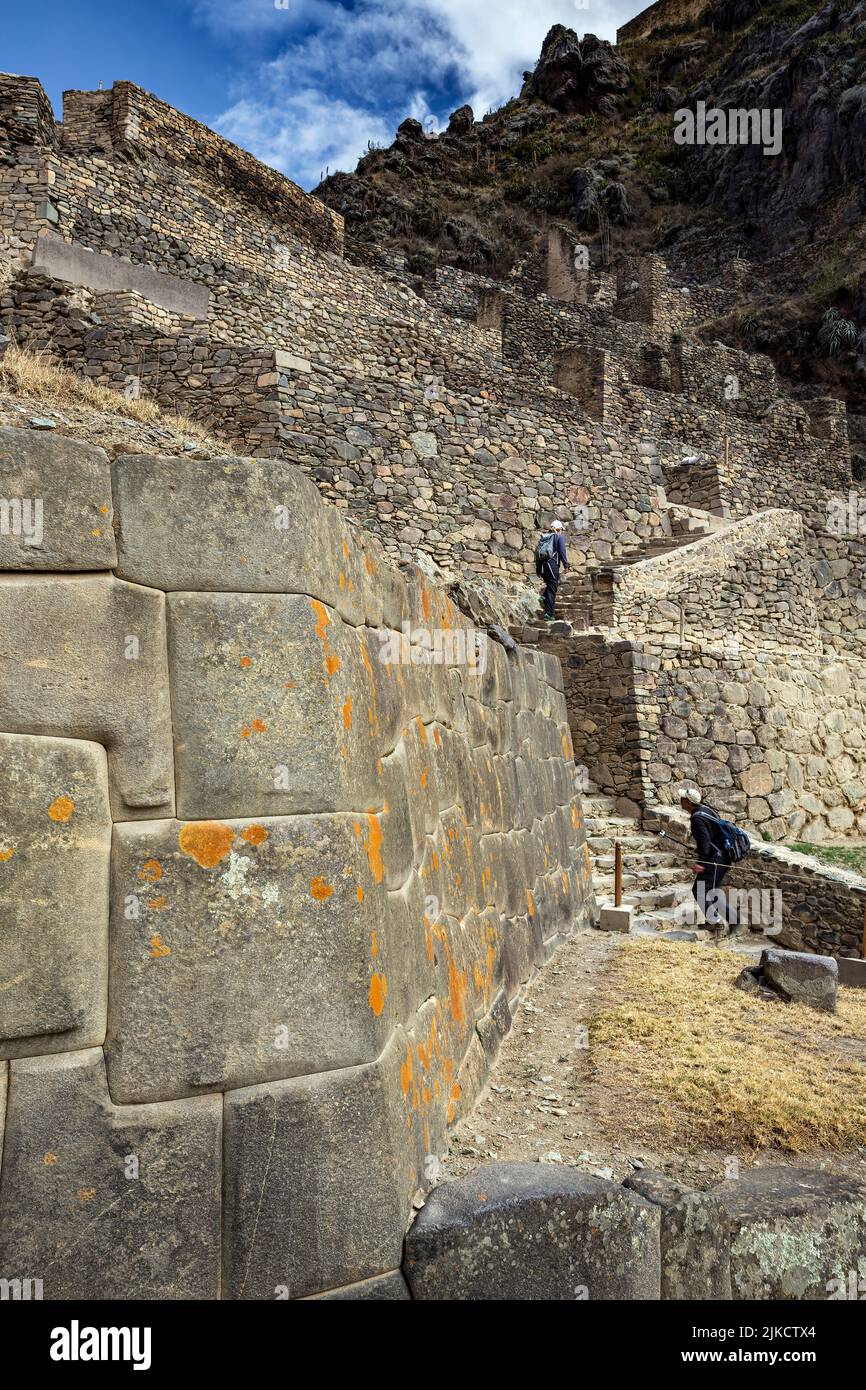 Stone walls and people on stairs, Ollantaytambo Inca ruins, Ollantaytambo, Urubamba, Cusco, Peru Stock Photo