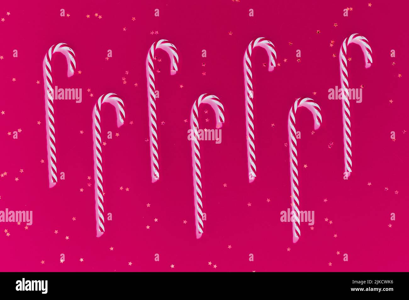 christmas greeting card candy canes star magenta Stock Photo