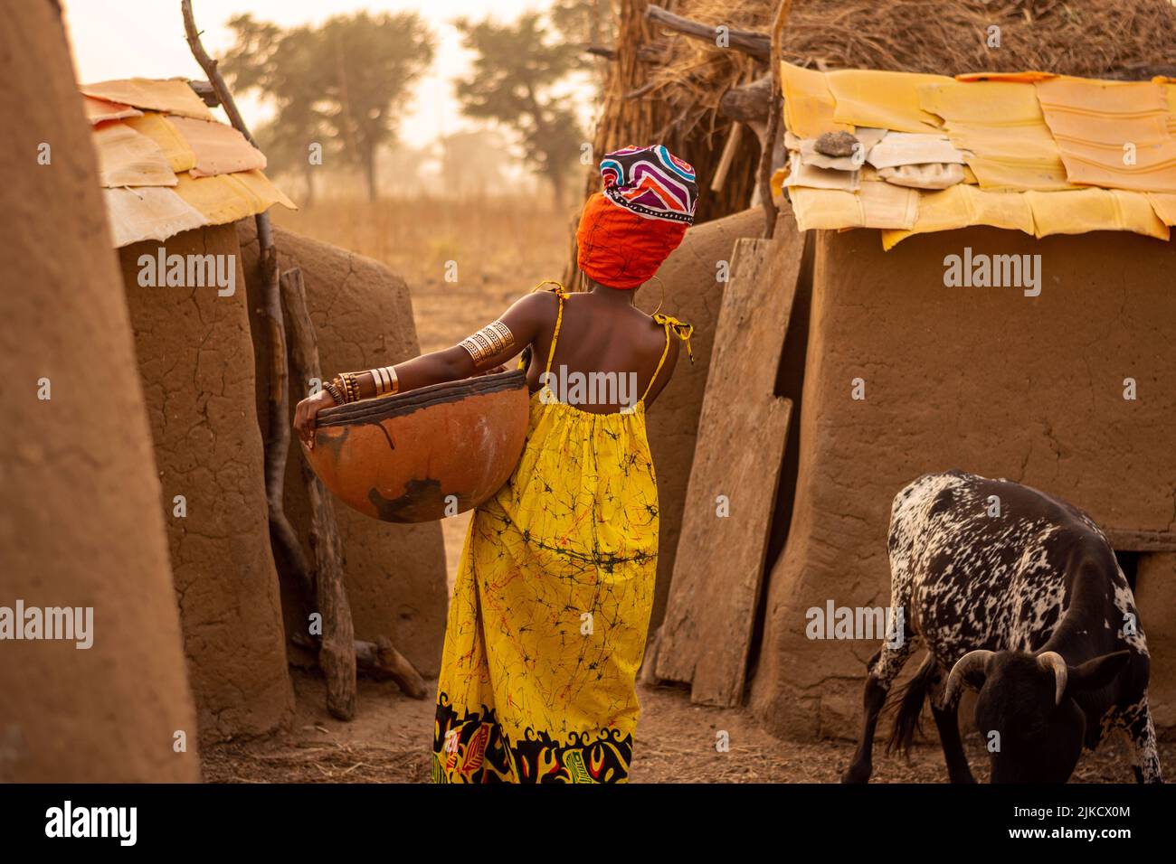 a model poses in a traditional home setting in northern ghana Stock Photo