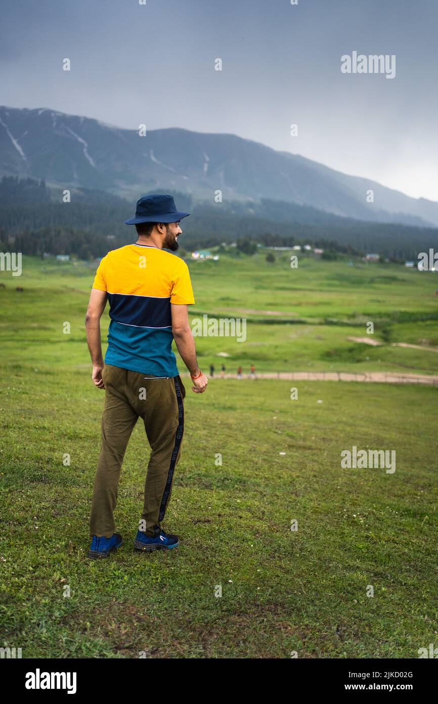 Traveler enjoying beauty scenery in Gulmarg valley during hot day in Jammu and Kashmir, India. Stock Photo