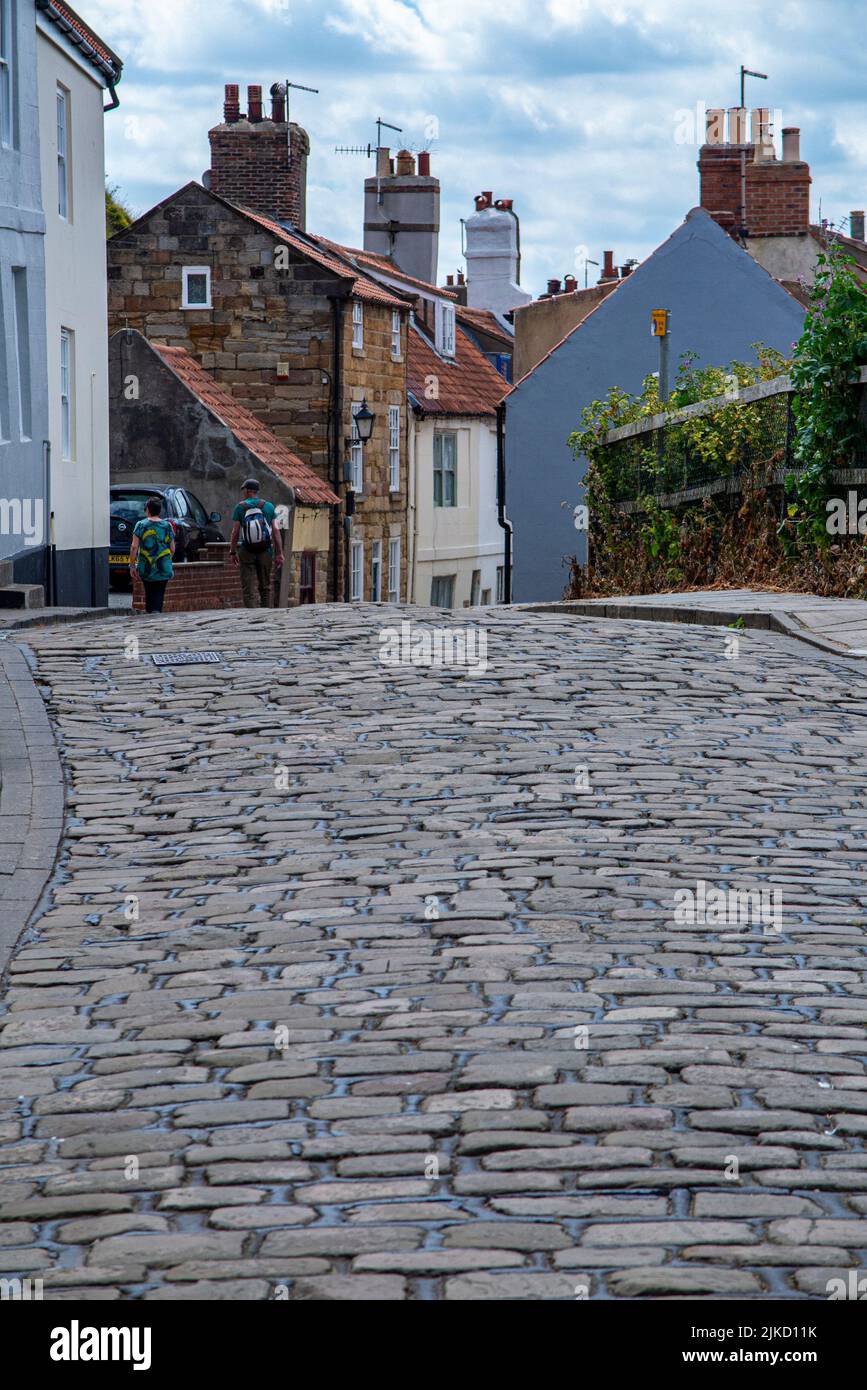 Narrow, cobbled streets in Whitby, a popular holiday destination in Yorkshire Stock Photo