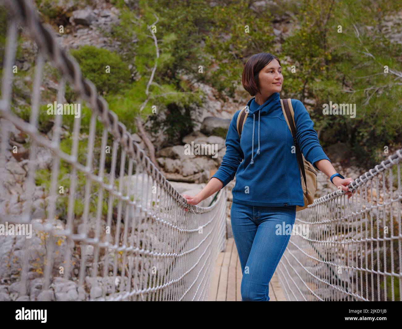 travel to Turkey, Kemer in autumn seasone. famous part of Lycian Way, Goynuk Canyon. Woman hiker trekking in mountains. Young lady walking with backpa Stock Photo