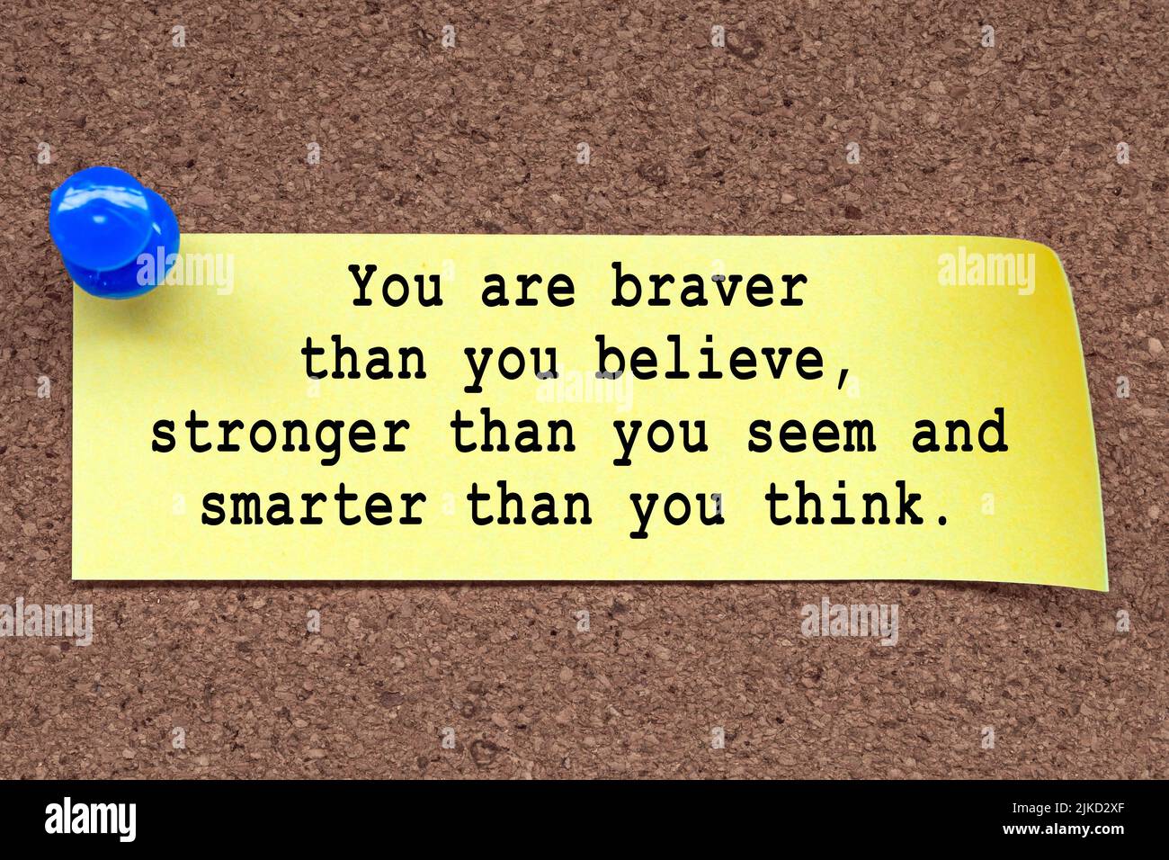 motivational-quote-on-stick-note-and-pinned-to-a-cork-notice-board