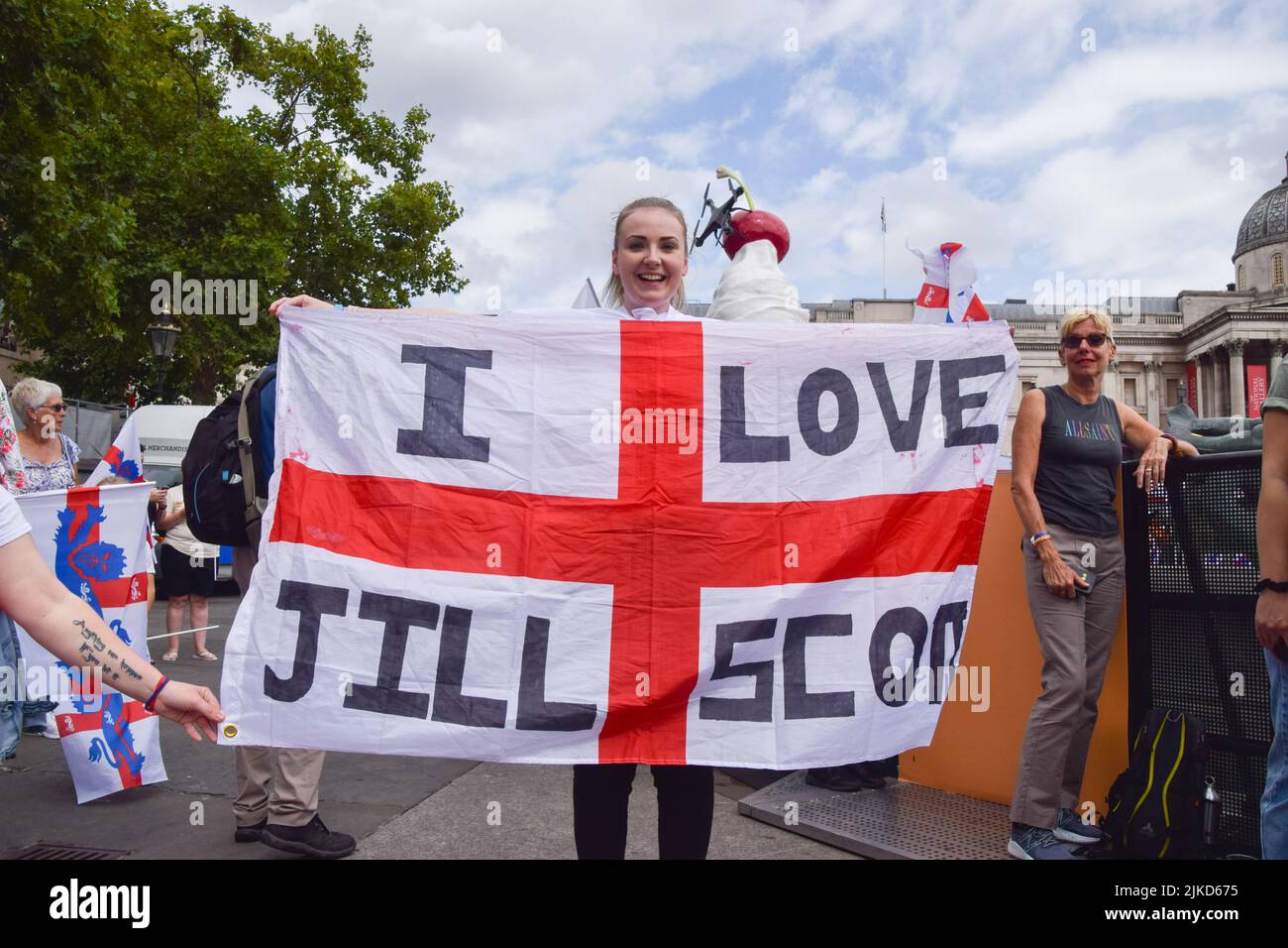 London, UK. 01st Aug, 2022. A fan holds an England flag with the message 'I love (England player) Jill Scott' during the Women's Euro 2022 special event in Trafalgar Square. Thousands of people gathered to celebrate the England team, known as the Lionesses, winning Women's Euro 2022 soccer tournament. England beat Germany 2-1. Credit: SOPA Images Limited/Alamy Live News Stock Photo