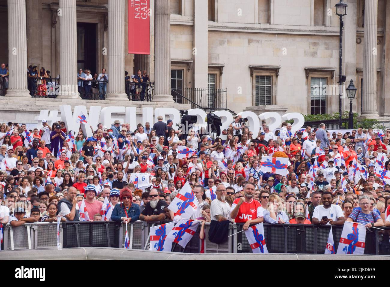 London, UK. 01st Aug, 2022. Supporters hold England flags during the Women's Euro 2022 special event in Trafalgar Square. Thousands of people gathered to celebrate the England team, known as the Lionesses, winning Women's Euro 2022 soccer tournament. England beat Germany 2-1. Credit: SOPA Images Limited/Alamy Live News Stock Photo