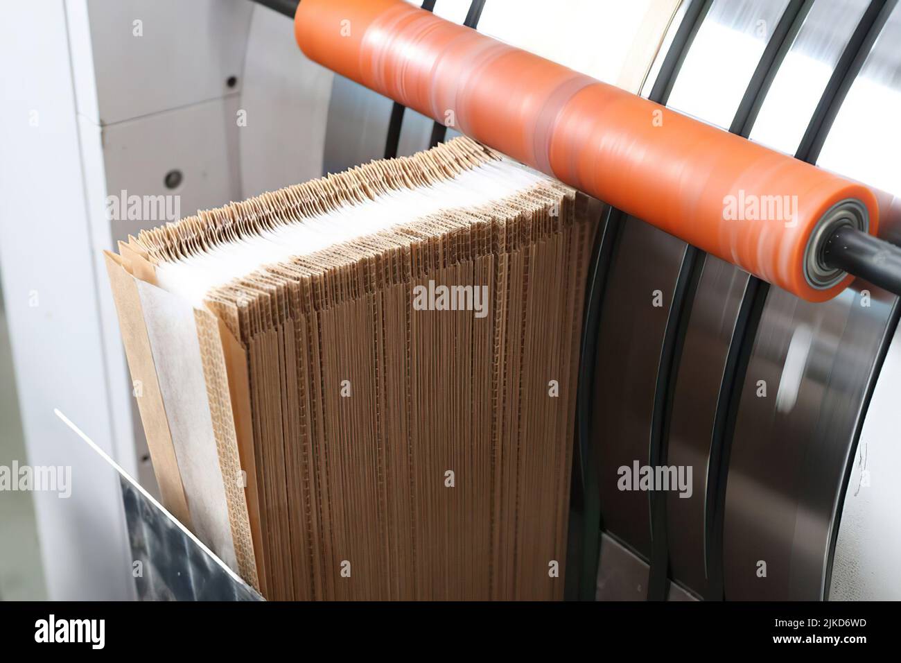 Paper package production on the plant, close up photo of machine Stock Photo Alamy