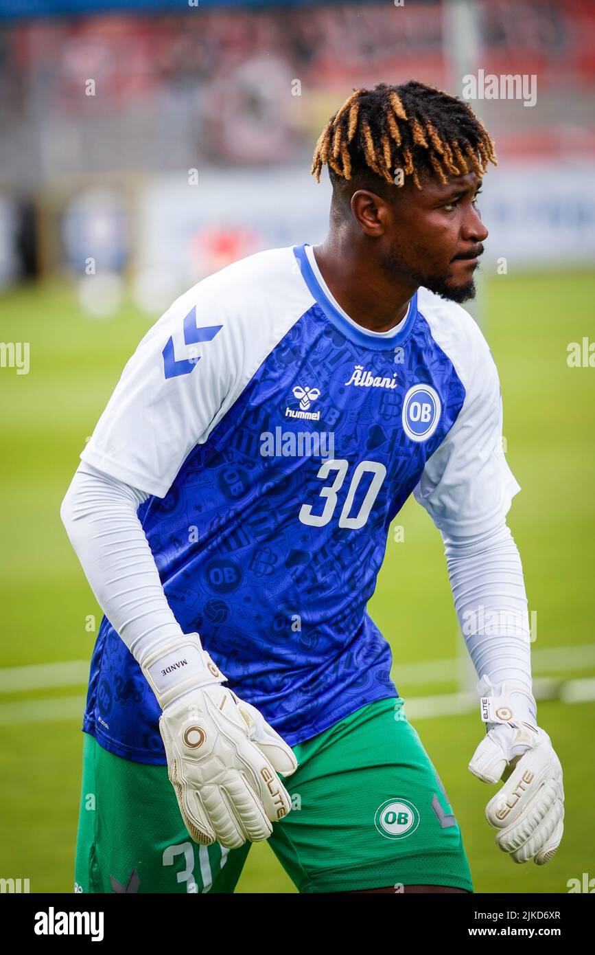 Odense, Denmark. 29th, July 2022. Reserve goalkeeper Sayouba Mande of OB is warming up before the 3F Superliga match between Odense Boldklub and FC Midtjylland at Nature Energy Park in Odense. (Photo credit: Gonzales Photo - Kent Rasmussen). Stock Photo