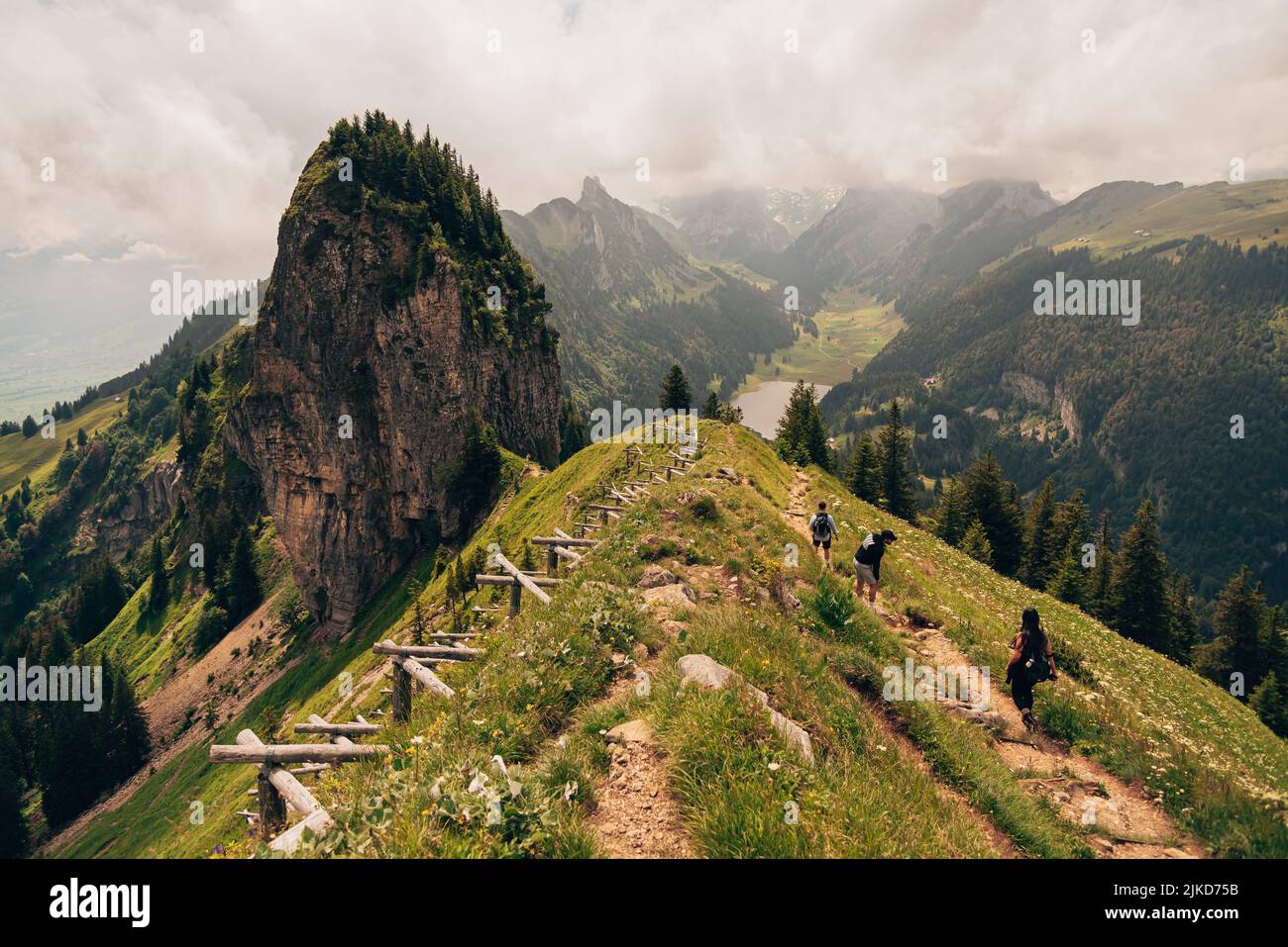 An aerial shot of the Alpstein mountain range in Switzerland with hikers Stock Photo