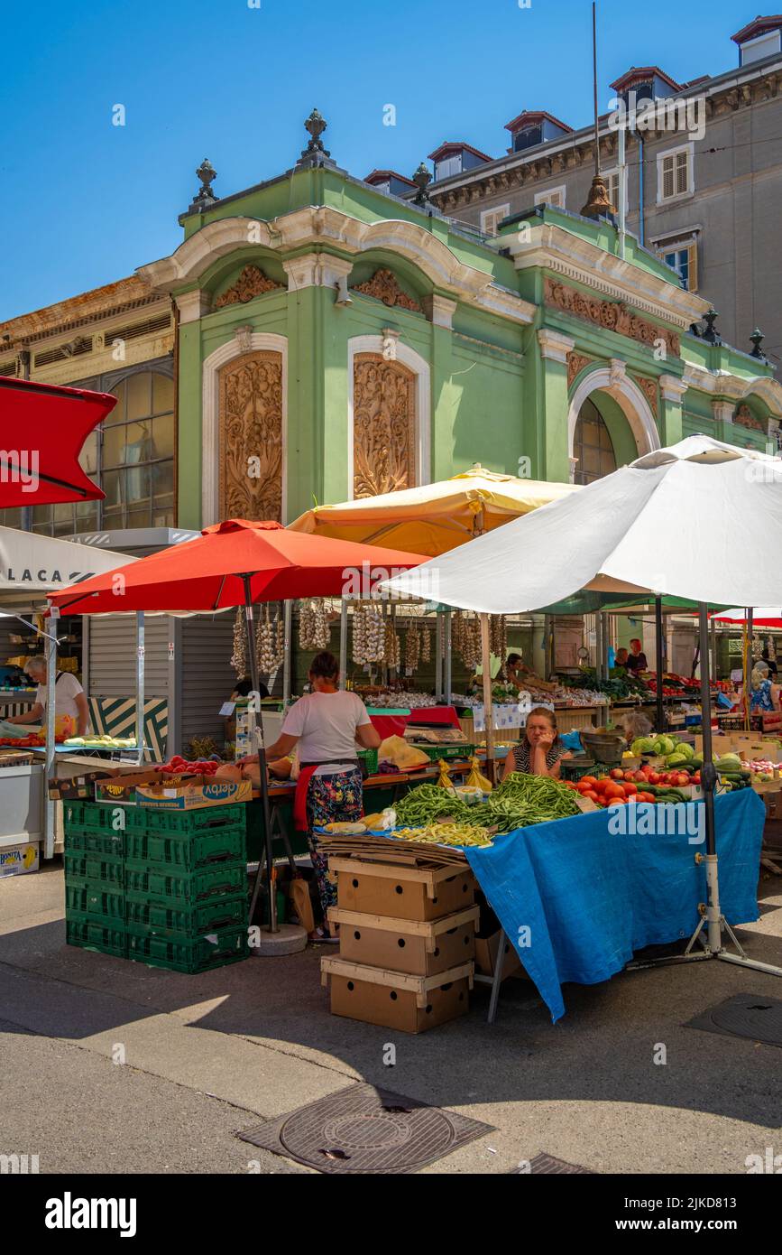 View of fruit and vegetable stall and exterior of ornate Central Market building, Rijeka, Croatia, Europe Stock Photo