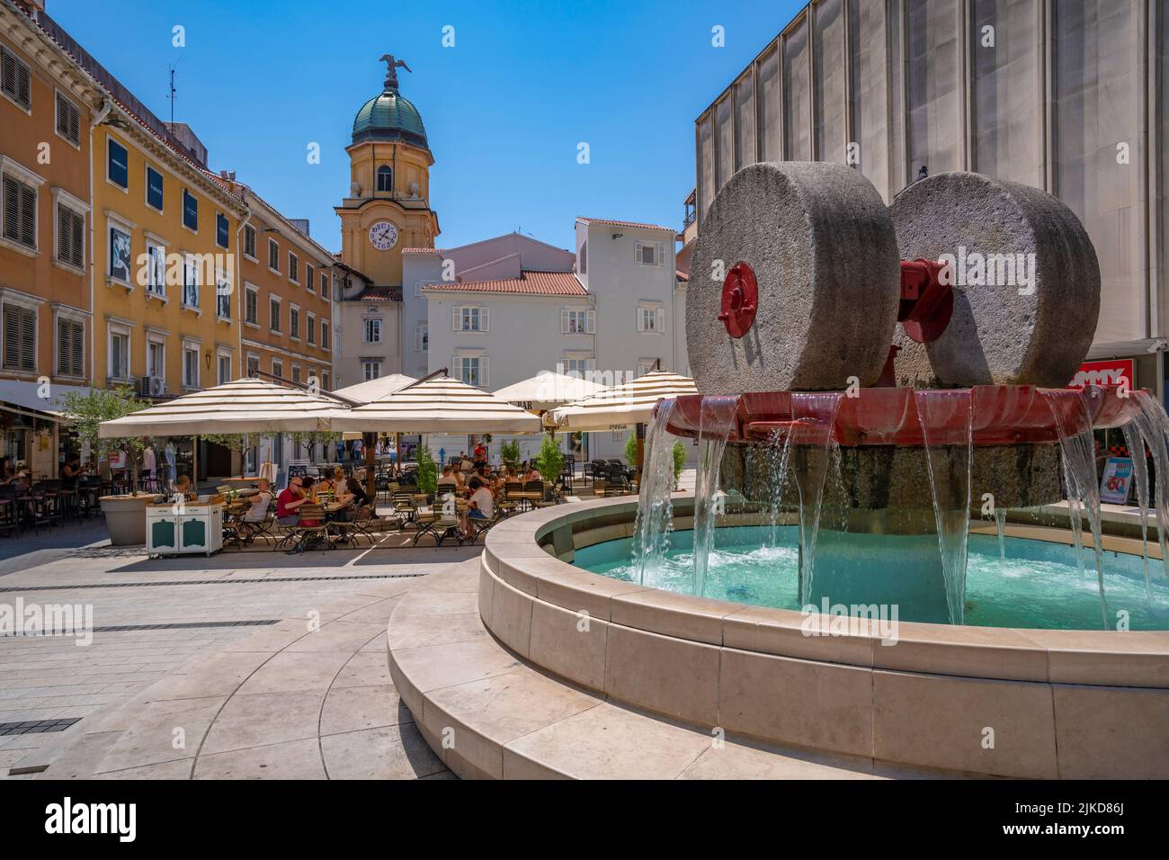 View of City Clock Tower, fountain and restaurants in Trg Ivana Koblera in old town centre, Rijeka, Croatia, Europe Stock Photo