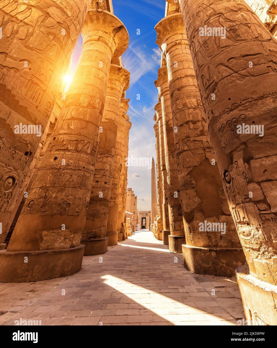 Columns with ancient carvings in the Great Hypostyle Hall of Luxor, Karnak Temple, Egypt. Stock Photo