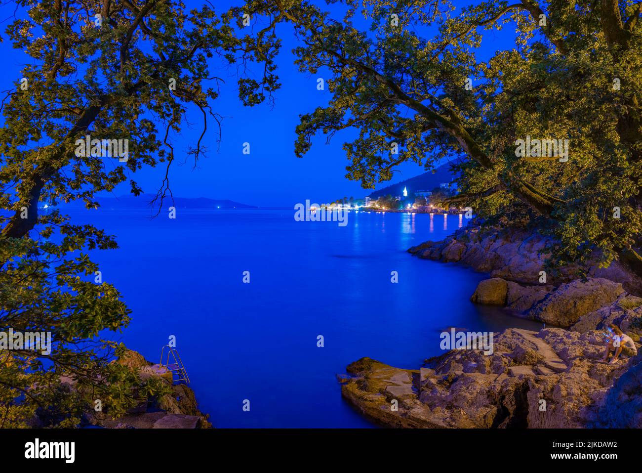 View of Lovran and Krk Island in background at dusk, Lovran, Kvarner Bay, Eastern Istria, Croatia, Europe Stock Photo