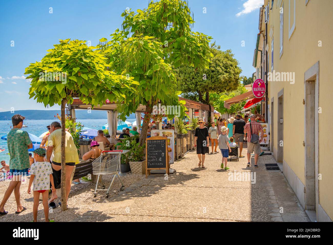 View of bars and cafes on the promenade in Mošćenička Draga, Eastern Istria, Kvarner Bay, Eastern Istria, Croatia, Europe Stock Photo